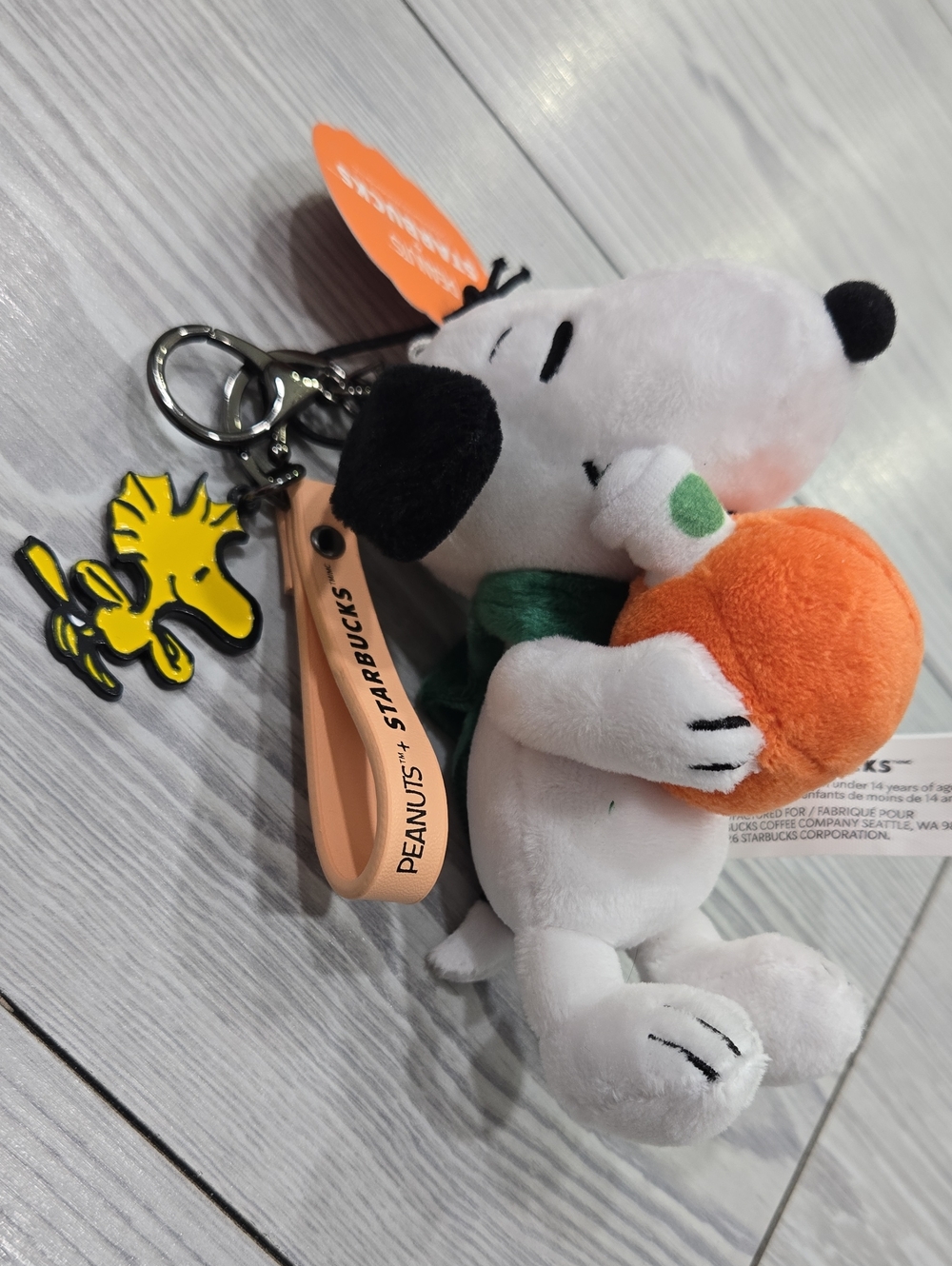 Peanuts Snoopy Plush Keychain by Peanuts in White, Black, Orange & Green